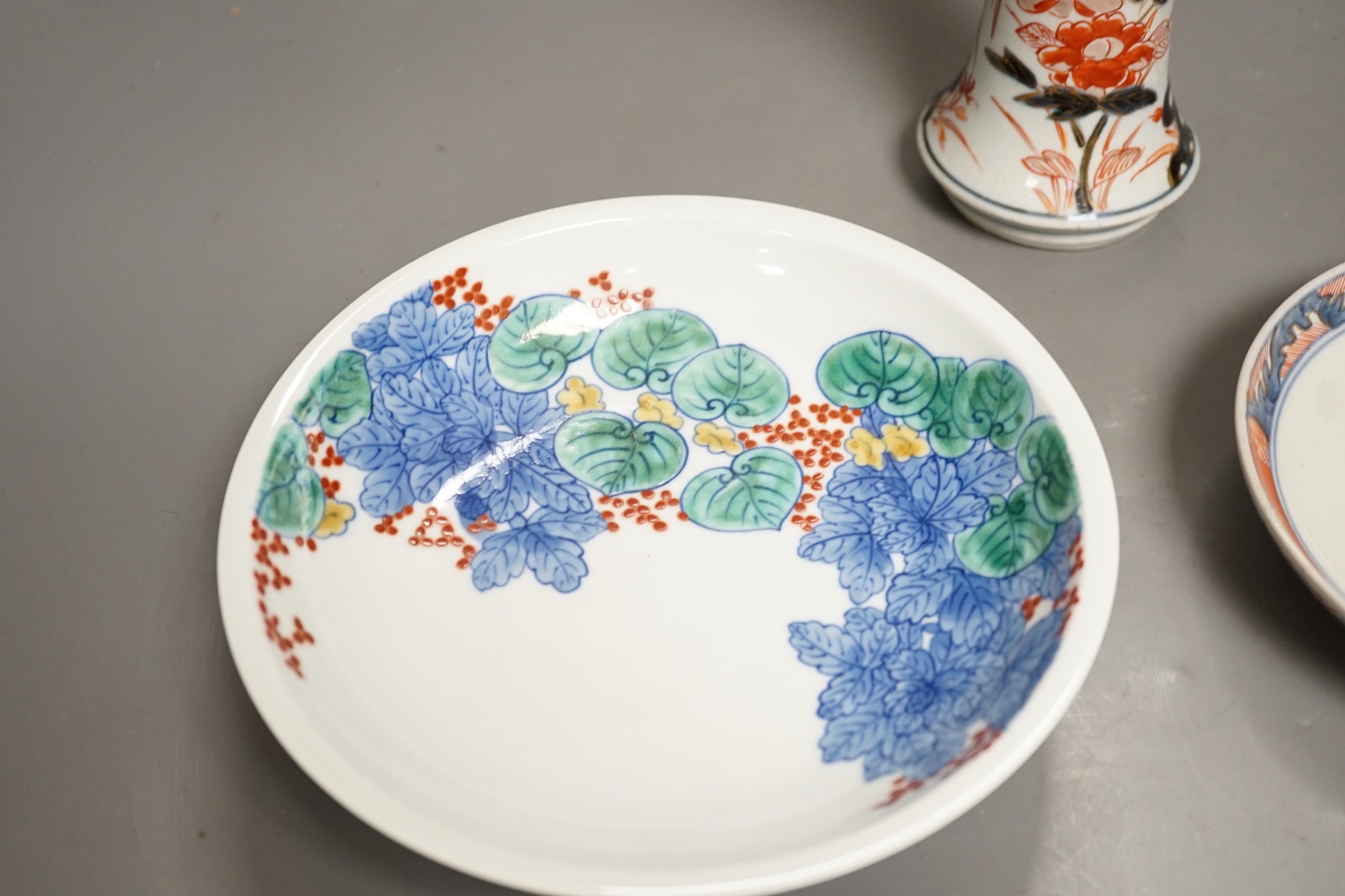 An 18th century Japanese Arita porcelain vase, a Nabeshima style dish and an Arita dish, height of vase 17cm